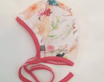 Pink watercolor flower pilot hat by Little Lapsi. Baby hat with ties. modern hearing aid