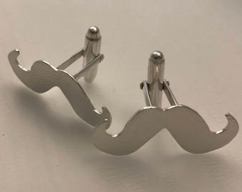 Silver mustache cuffs
