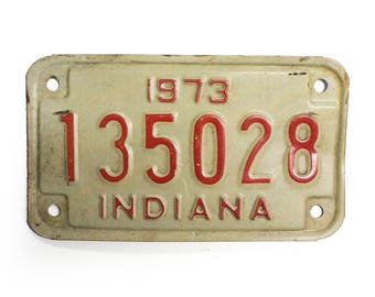 1973 Indiana Motorcycle License Plate - White And Red Vintage Used Bike License Plate (77-BO-LP-0084)