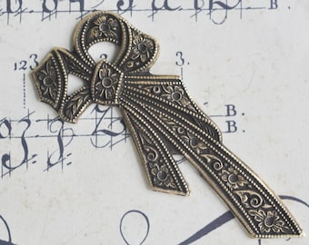 Neo Victorian Brass stamping, sideways bow, brass ox bows, brass bows, Craft Supplies by Calliopes Attic