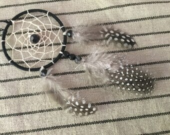 Dream catcher that will accompany you in your car hanging from a rear view mirror