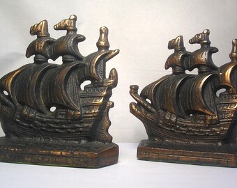 An Antique Pair of Arts and Crafts Cast Iron Bookends A3