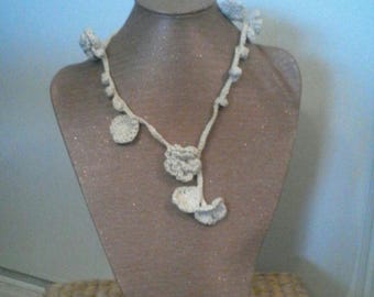 Necklace is crocheted in cotton, flowers, leaves and Bobbles