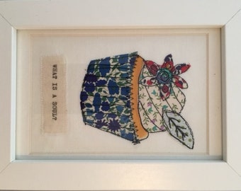Textile applique picture. Philosophical cupcake