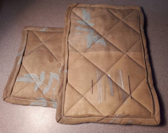 Pair of tan fabric trivet, 2 tone