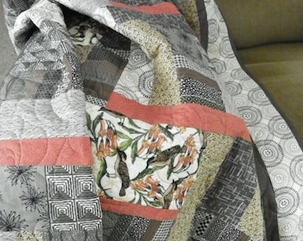 Catbirds in a geometric lap quilt