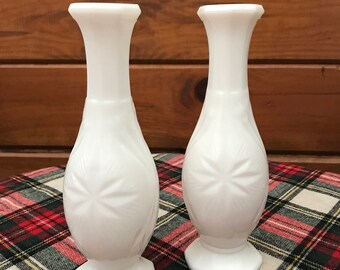 Set of two vintage white, milk glass bud vases with star/atomic design.