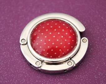 Bag hanger with red dots