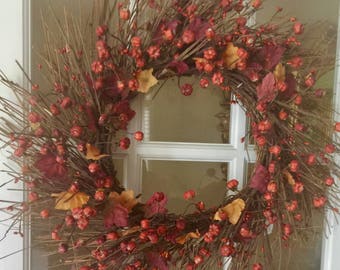22" Pumpkin and Leaves pip Berry wreath.