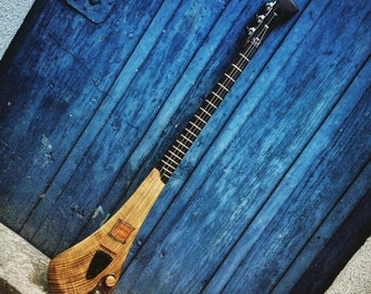 Electric 3-string guitar by DaShtick guitars. Handcrafted Celtic diddley bow. CBG