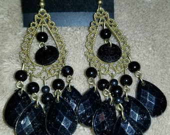 Black tear drops with vintage gold color.