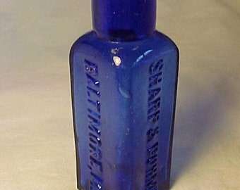 c1890s Sharp & Dohme Baltimore, MD., Cork Top Cobalt Blue Glass Triangle round back Poison Bottle