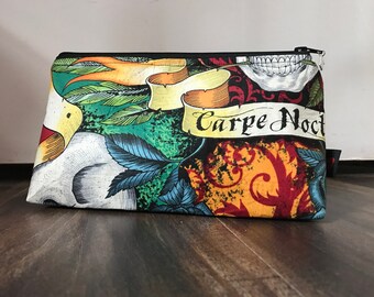 Zippered makeup pouch in a seize the night (carpe noctem) skull fabric
