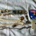 Nineteen Pieces of miscellaneous vintage jewelry..key fob, 2 tie clips, 5 pins, 3 cuff links, 2 pr earrings, 2 "pearl" necklace 2 chains