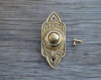 A Victorian Gothic revival style brass door bell CB7