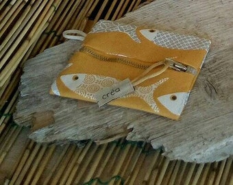 Wallet fish on yellow background