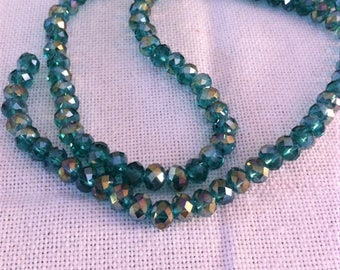 10 Crystal faceted beads green round 6 x 8 mm