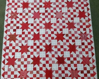 Red and white star quilt top