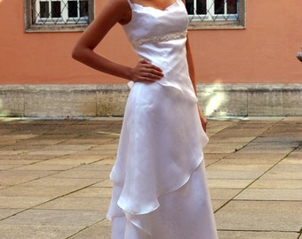 wedding dress with layered skirt and embroidered ribbon