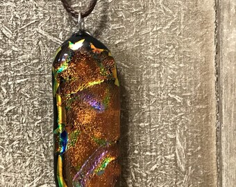 Dichroic glass pendant on black cord
