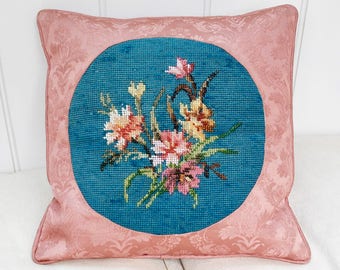 An antique floral beadwork and needlepoint cushion