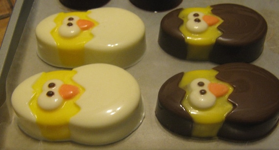One dozen chick popping out of an egg chocolate covered sandwich cookie