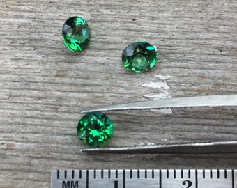 One 5mm faceted "Rainforest" green topaz semiprecious gemstone