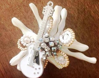 Beach wedding boutonniere with guitar
