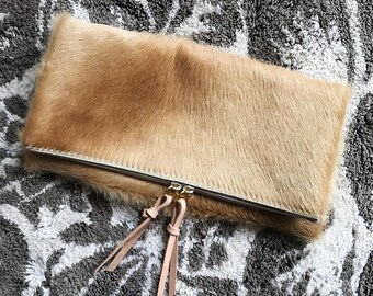 Blonde hair on hide fold down clutch