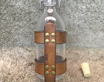 Medium size 500ml medieval style glass bottle with leather holder and 2 closure , high quality.