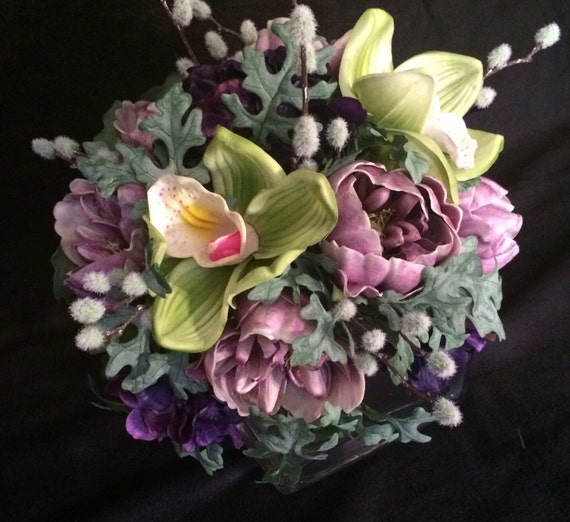 Soft colors bouquet. Real touch lime orchids, lavender peonies, dusty miller greens. You choose the color of ribbon wrap.