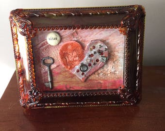 Heart art, mixed media collage. Mid century lucite faux tortoise shell frame with easel back. One of a kind.