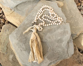 Hand knotted pearls with silk sari ribbon tassel