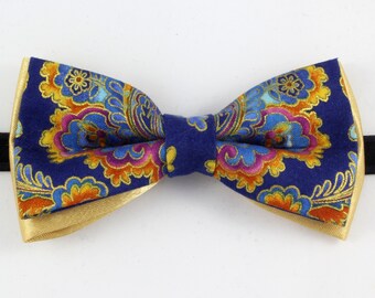blue and gold patterned bow tie