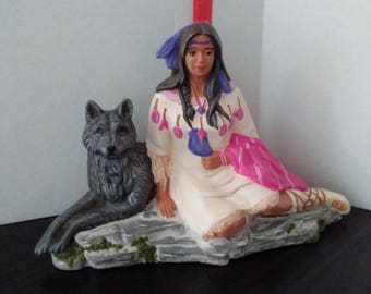 Indian maiden sitting with wolf