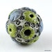 Dark Cornflower Blue Textured Sprigs with Chartreuse Yellow Crators and Blackish Gray Background Stoneware Ceramic Bead