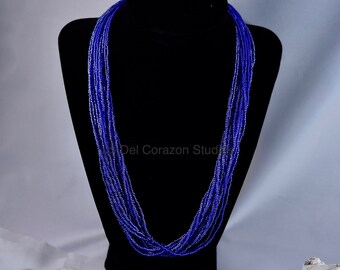 Dazzling blue multi-strand, beaded necklace, 21”, transparent and rainbow blue glass seed beads