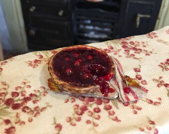 Dolls house food 12th scale cut cherry tart on rustic board