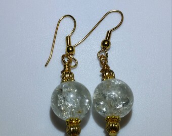 Crystal clear crackle glass earrings with gold accents hung from gold hypoallergenic hooks