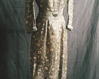 1950s hieroglyphics silk dress in olive green.