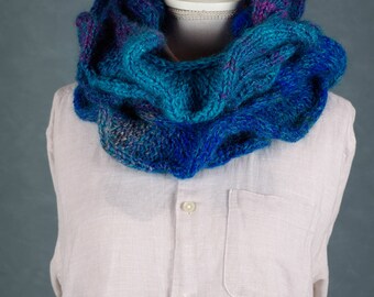 Knitted scarf in different shades of blue