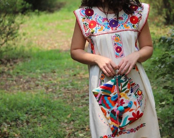 Otomi Multi colored clutch with hand embroidered tassels