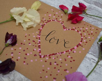 Pink heart 'love' greeting card