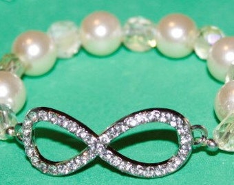 Creamy White Pearl Bracelet with Silver Infinity Connector and Creamy White Crystals; Earrings included; Silver Infinity Connector