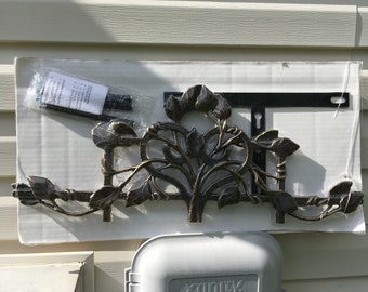 Vintage cast iron garden hose holder hanger leaf vine pattern rust brown color. New, original packaging, hardware and instruction enclosed.