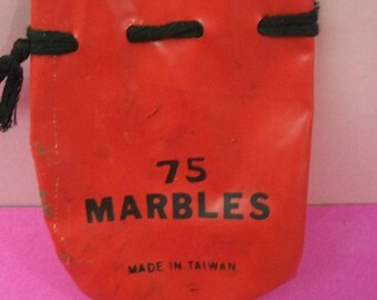 Red Marble Bag 75 Marbles On Front Made In Taiwan Vinyl Marble Bag With Black Drawstring Lots of Scuffing And Wear No Marbles