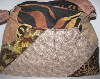 Quilted purse with browns, tans, animal print. My pattern with a lot of pockets