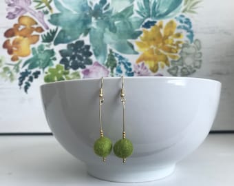 Dangle earrings with green felted wool bead