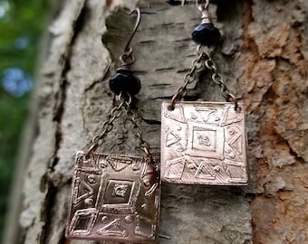 Handmade etched copper earrings.