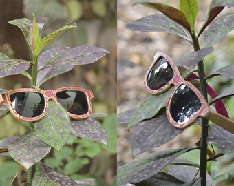 Handmade lenses with recycled wooden skateboards